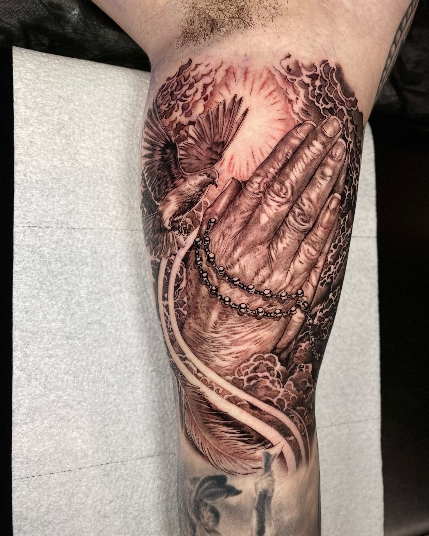 Praying hands realism tattoo on the forearm by Gerardo Brawder
