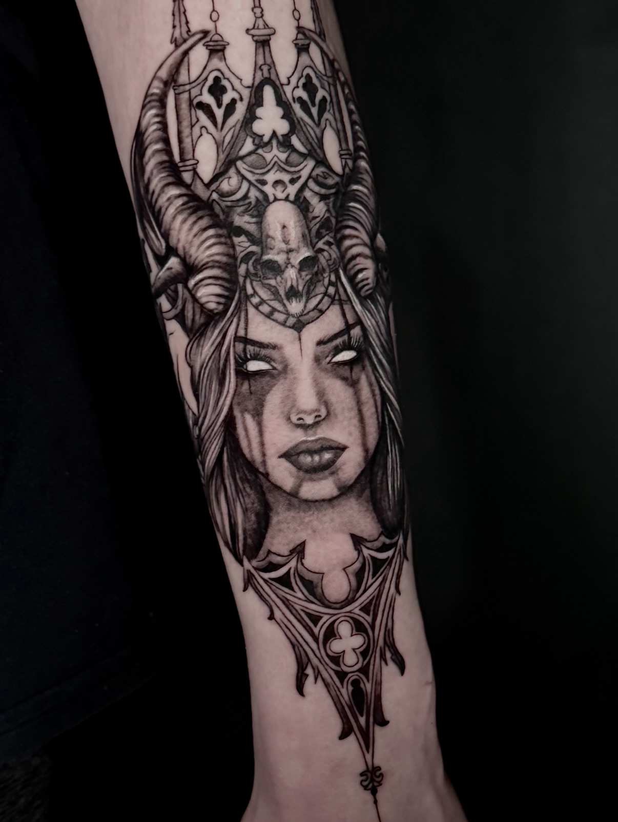 Woman with horns realism tattoo on the forearm by Kris Tattoo Chicago