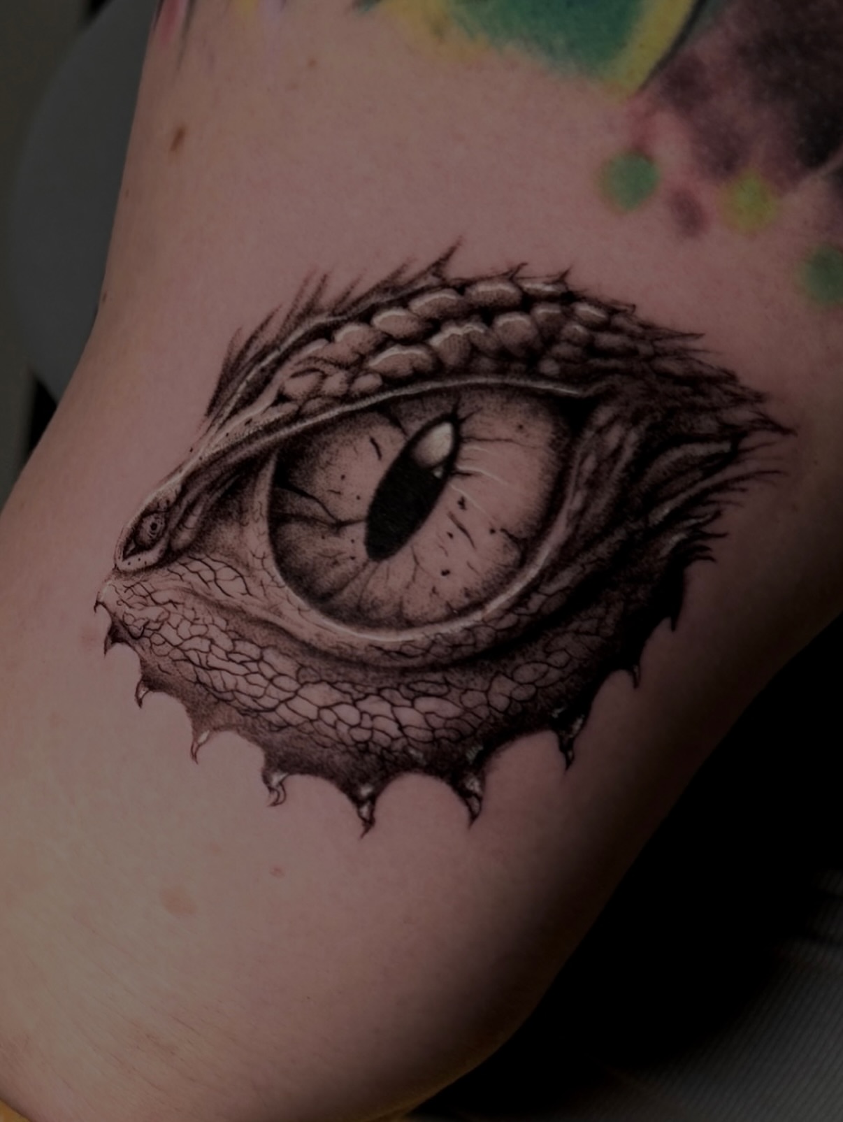 Dragon eye realism tattoo on the forearm by Kris Tattoo Chicago
