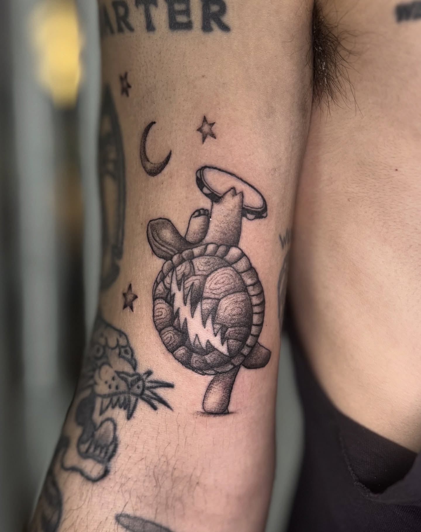 Turtle balancing mushroom black and grey tattoo on the forearm by Khang🇻🇳