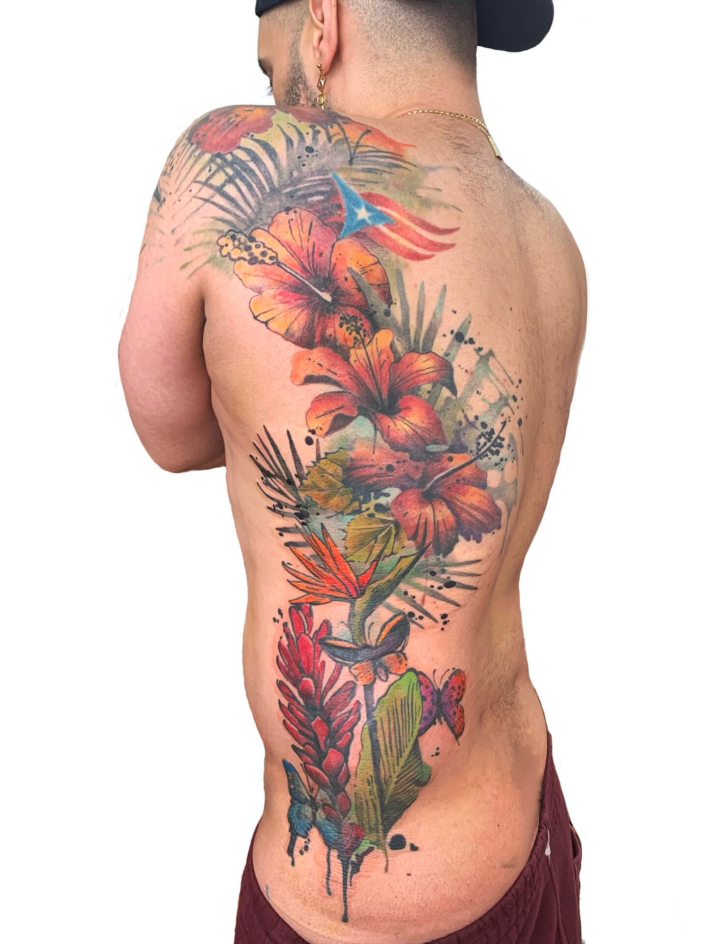 Tropical flowers watercolor tattoo by Gene Coffey, New York, New York