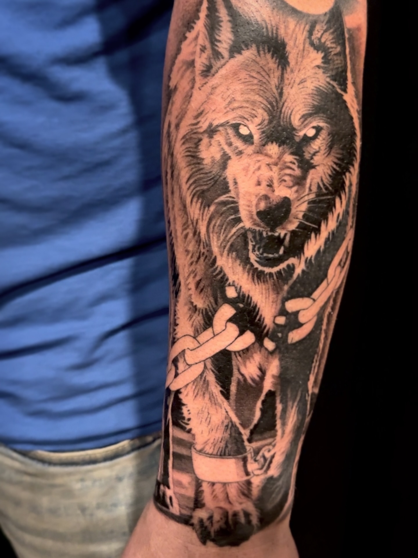 Wolf realism tattoo on the forearm by Elijah Forster - Nashville Tattoo Artist