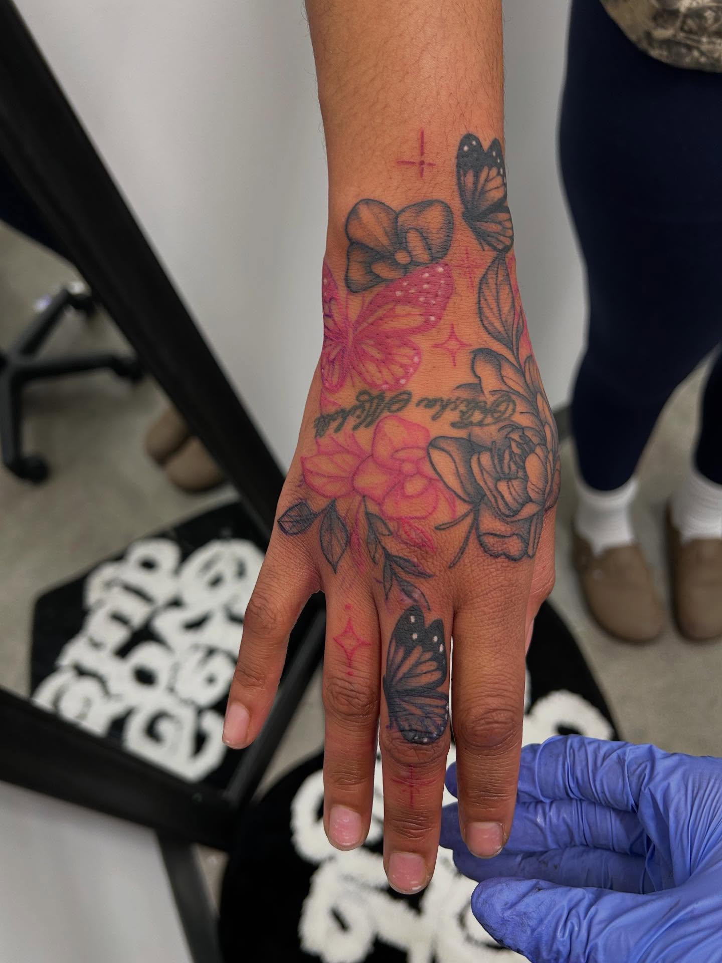 Butterflies and flowers new school tattoo on the hand by Stephania ATLANTA TATTOO ARTIST🎨