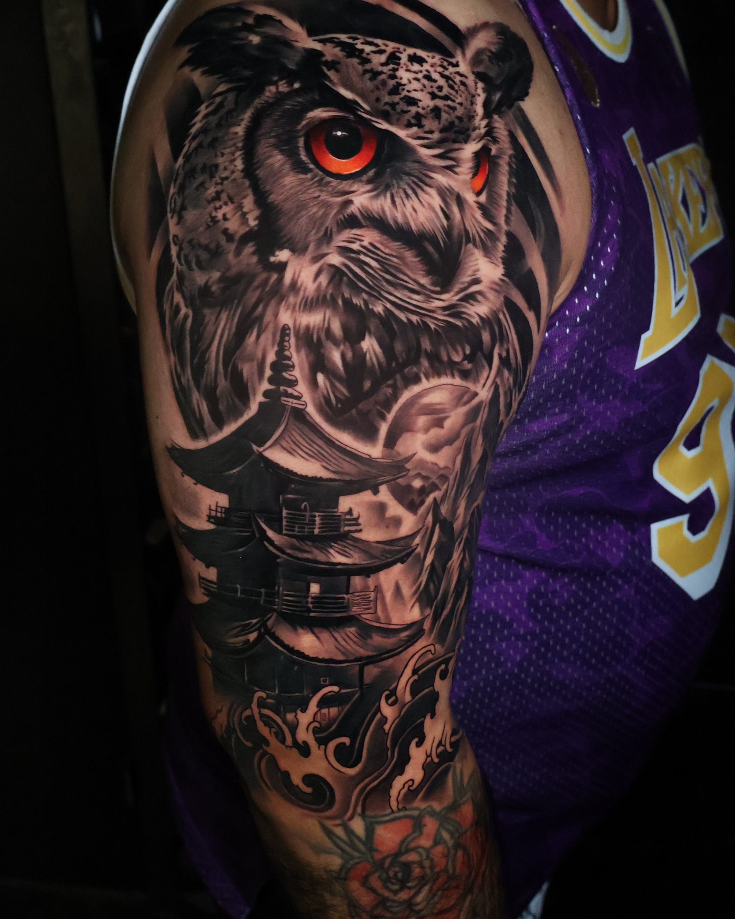 Owl realism tattoo on the upper arm by Angels tattoo