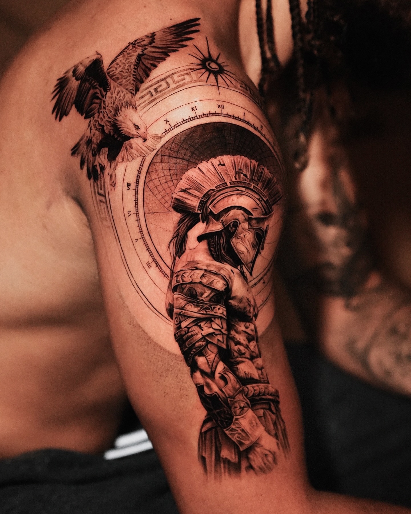 Roman warrior with eagle realism tattoo on the shoulder by Kid Needle