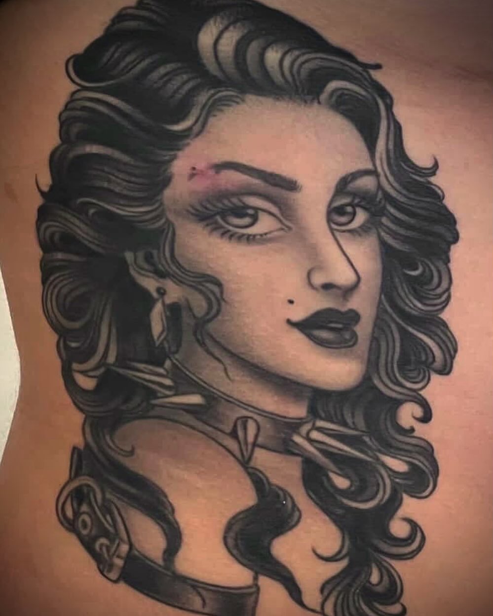 Woman with long hair American traditional tattoo on the thigh by Adam Warmerdam, Los Angeles, California