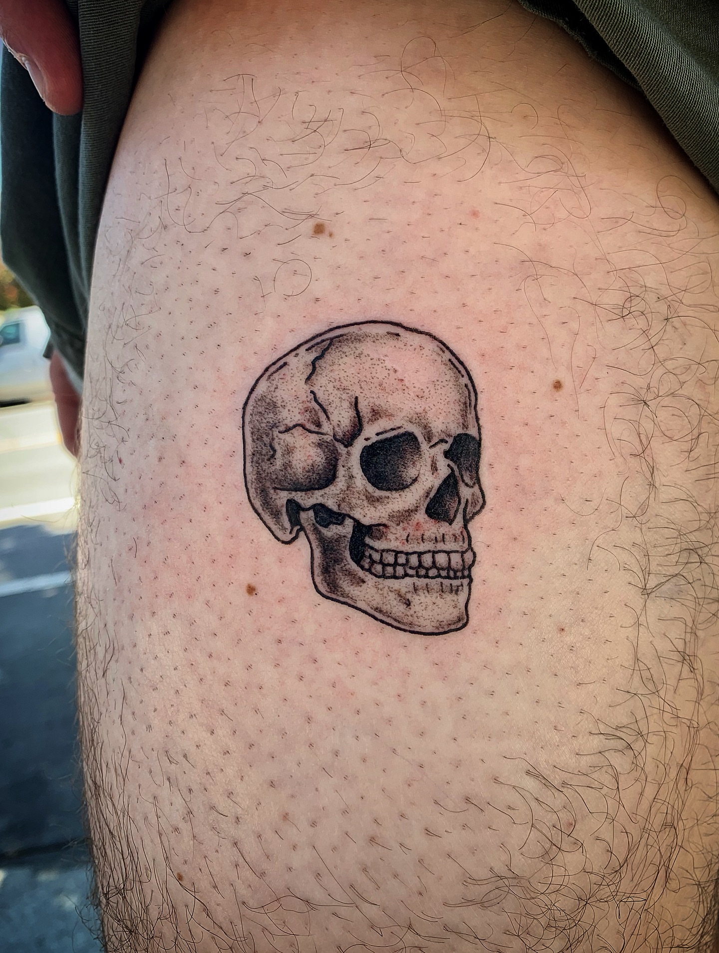 Skull dotwork tattoo on the thigh by Laura