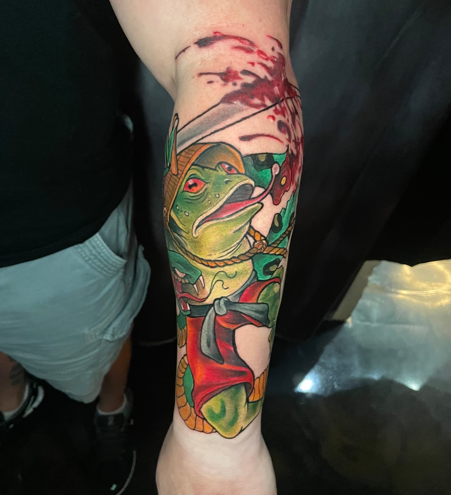 Frog American traditional tattoo on the forearm by Tivis Phillips