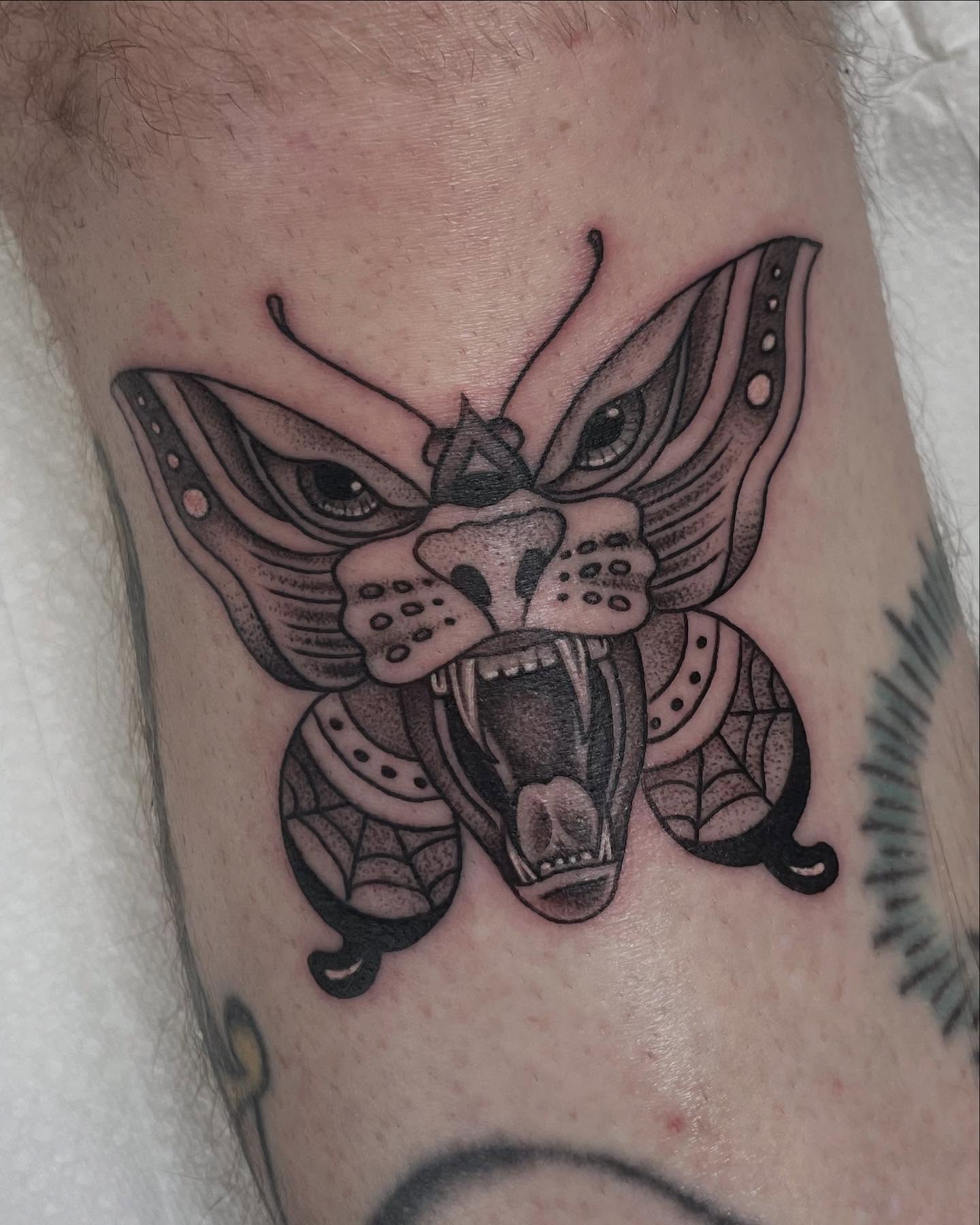 Butterfly black and grey tattoo on the forearm by Micheal McGlinchey