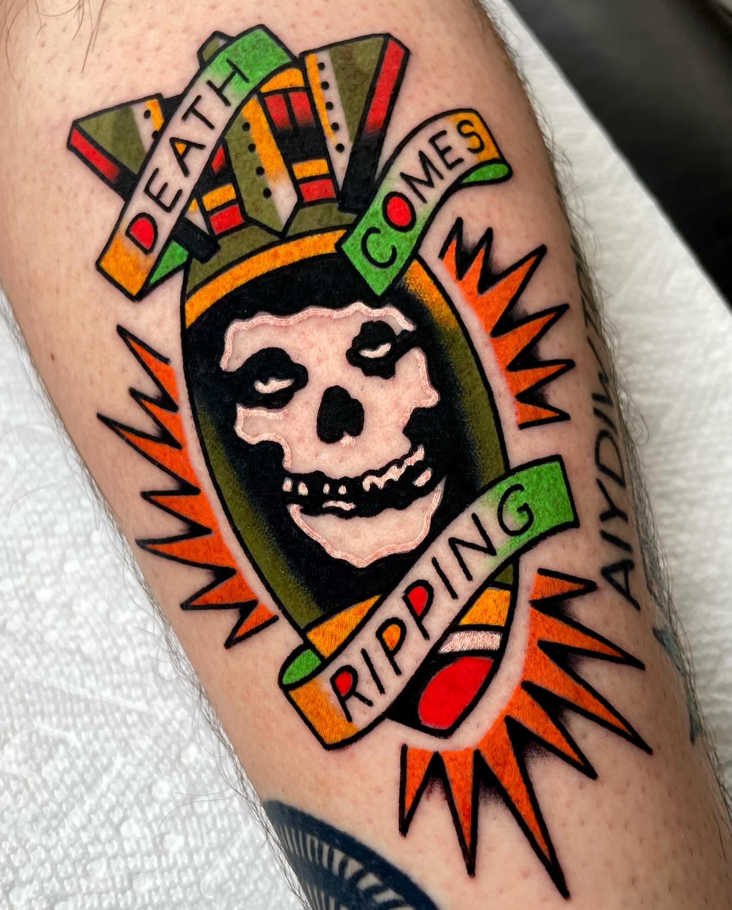 Skull with banner American traditional tattoo on the forearm by Ryan McDonald