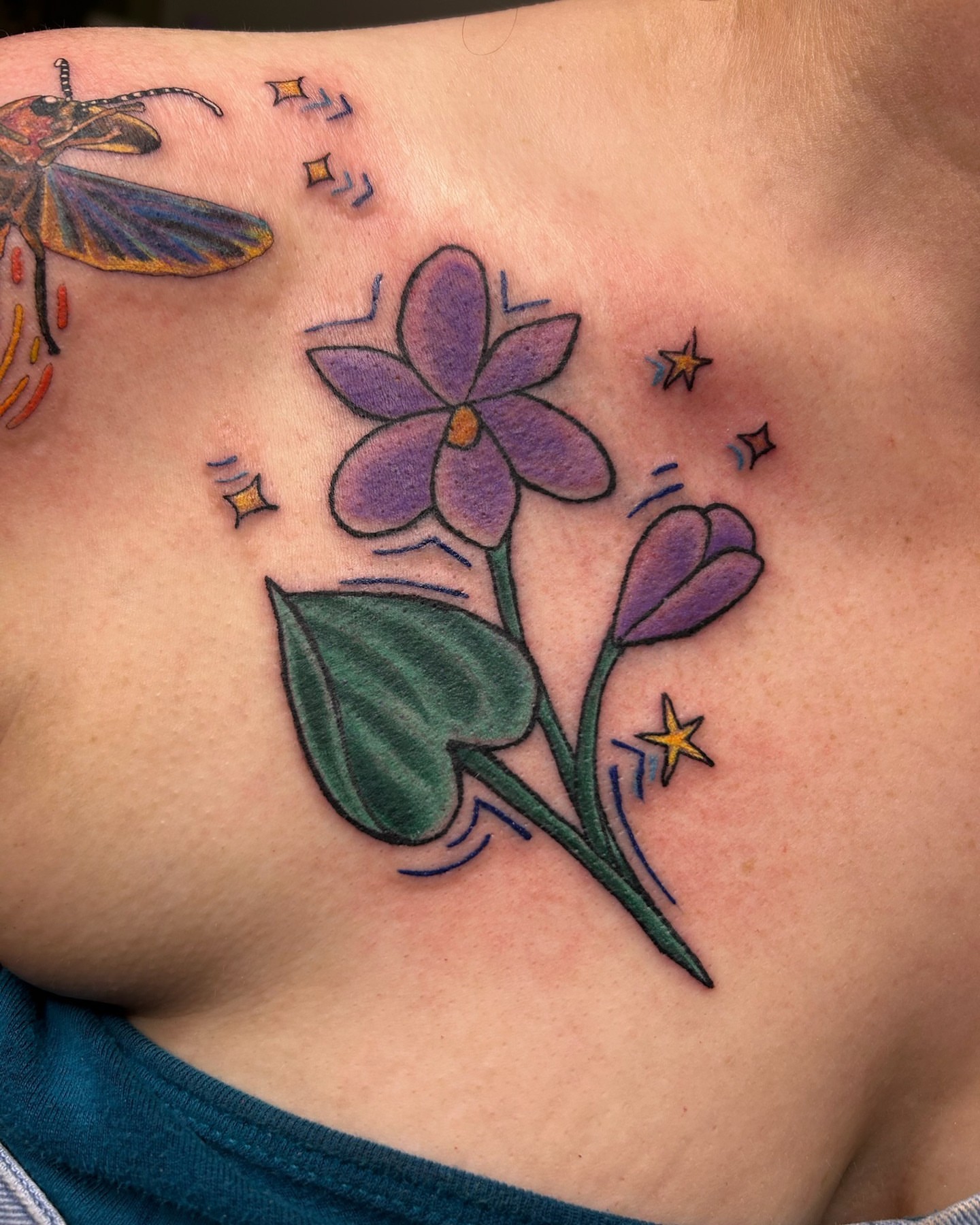 Purple flower American traditional tattoo on the shoulder by Matt Williamson