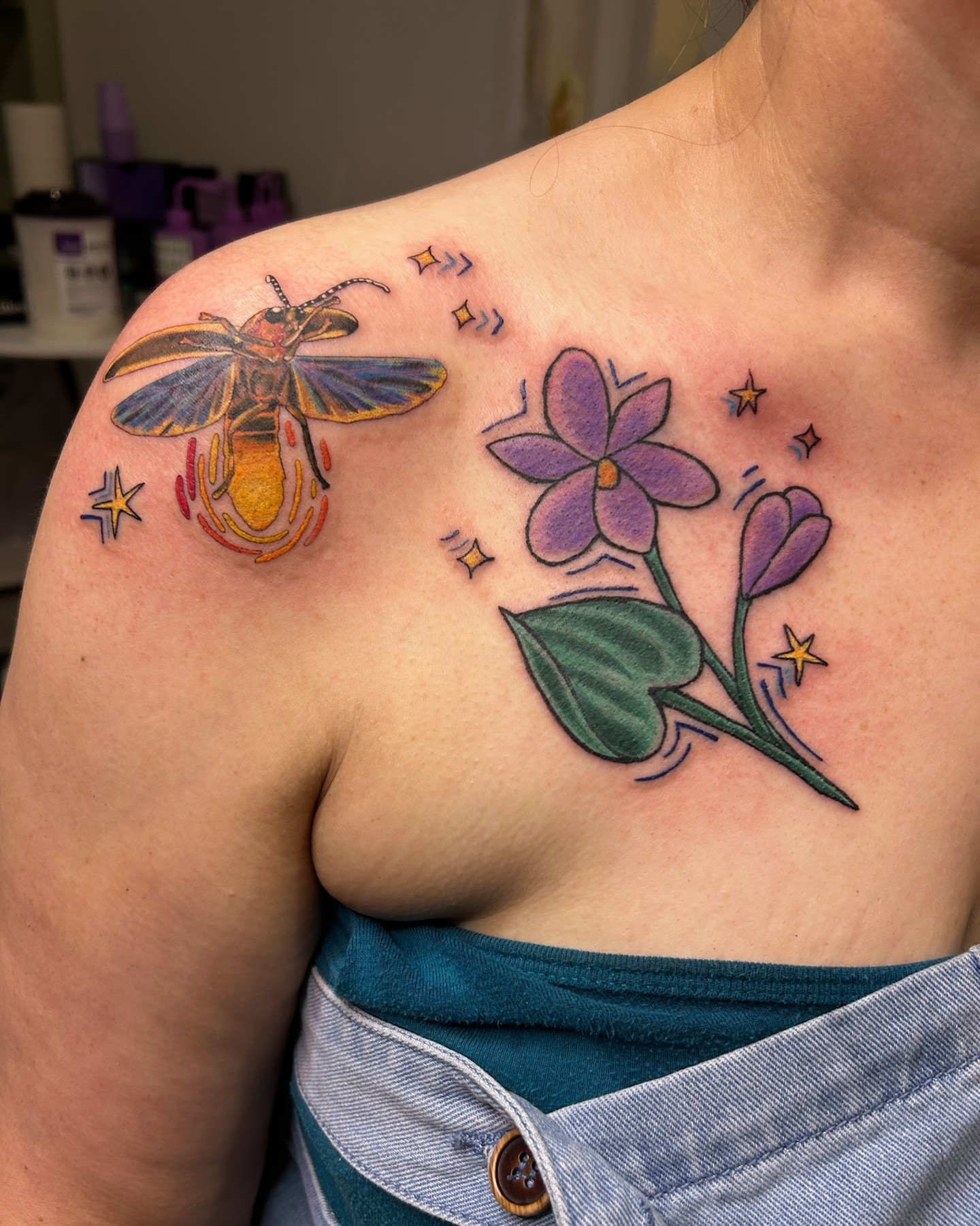 Firefly and flowers new school tattoo on the shoulder by Matt Williamson