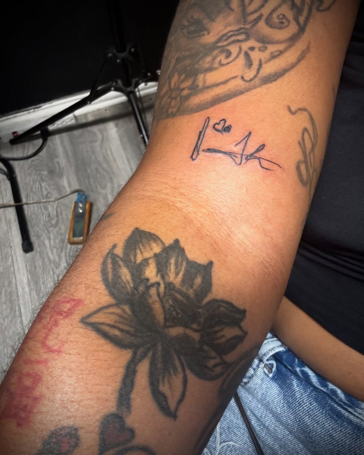 Lotus flower black and grey tattoo on the forearm by Vanessa - Dallas Artist