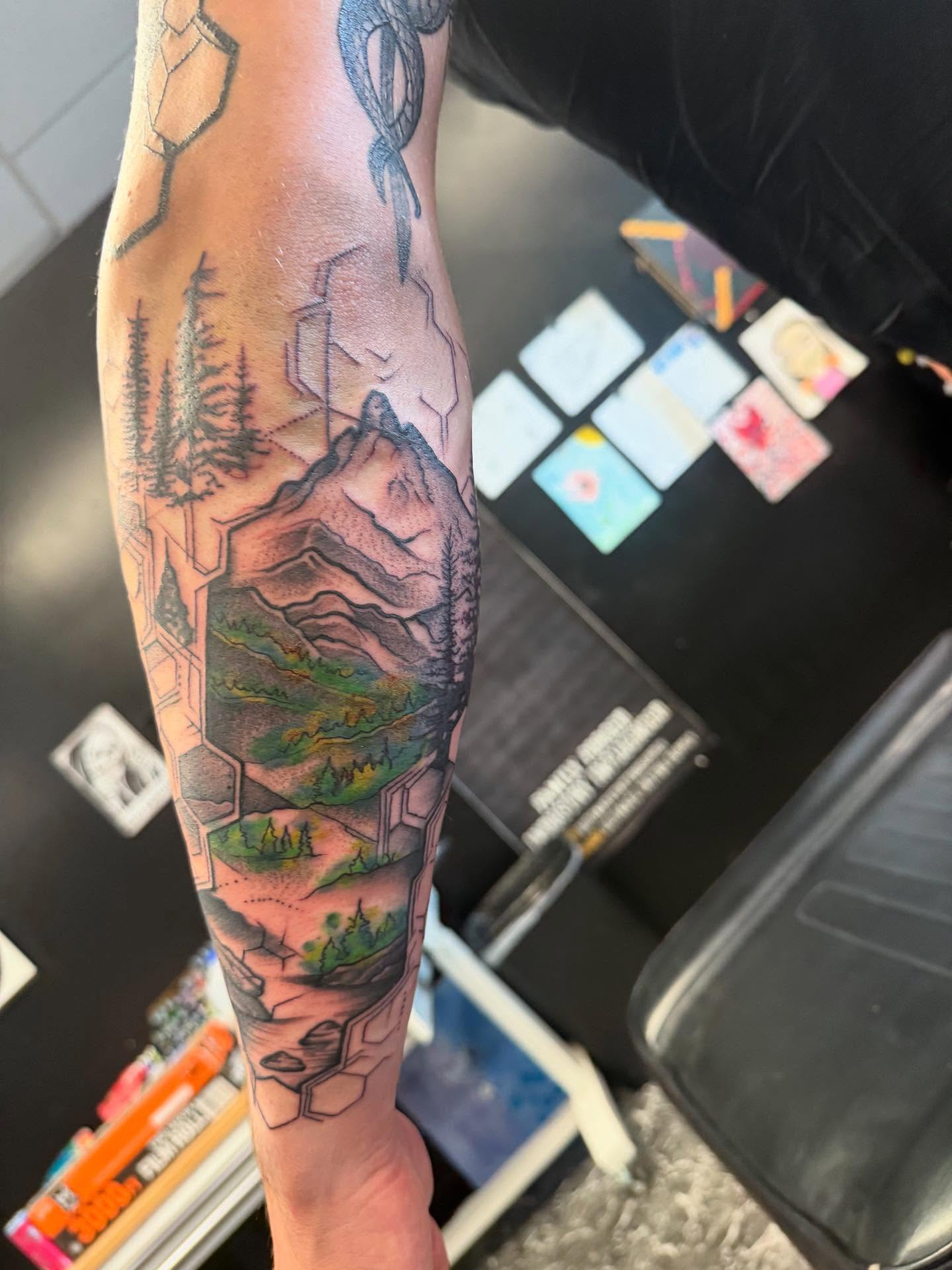 Tattoo by @scottys_ink315 — realism, geometric