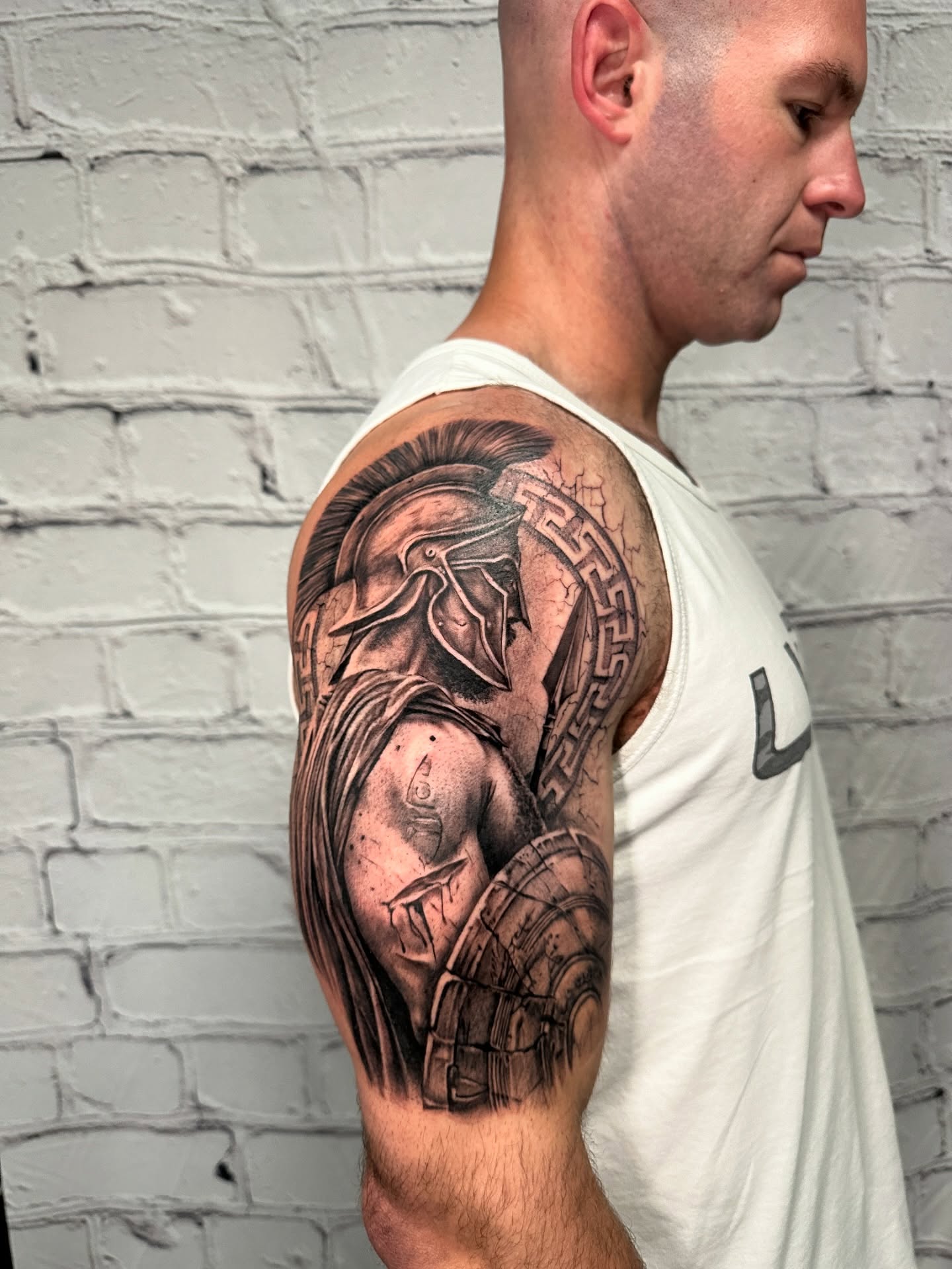 Spartan warrior realism tattoo on the shoulder by Stephen Hansen