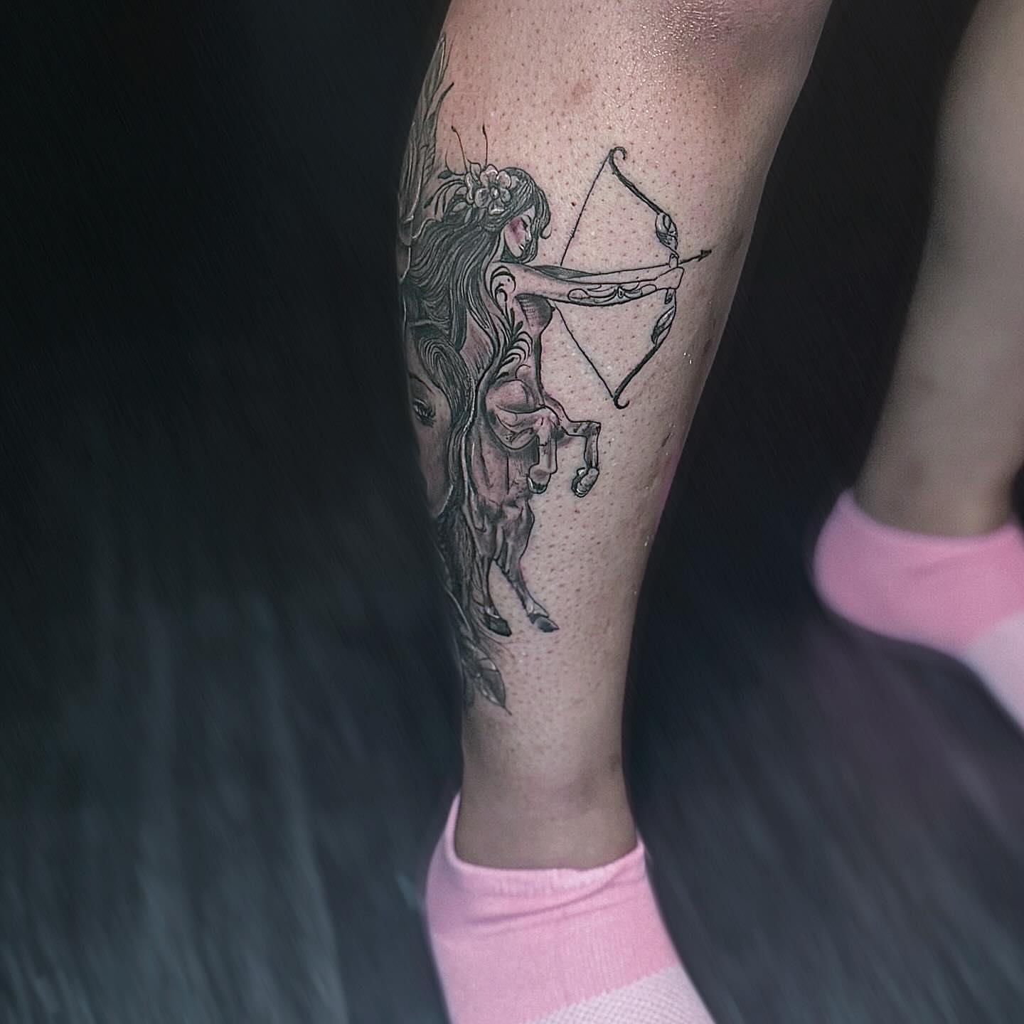 Archer on horseback black and grey tattoo on the forearm by Ken West