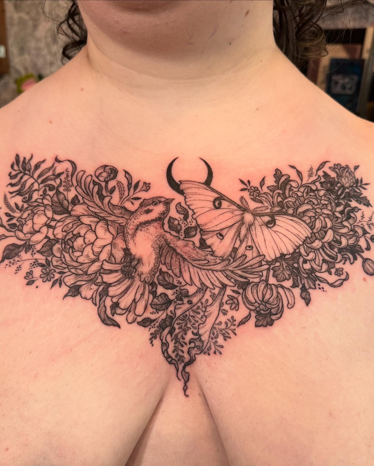 Bird and floral bouquet ornamental tattoo on the chest by Rebeka Chase [Sobodacha]