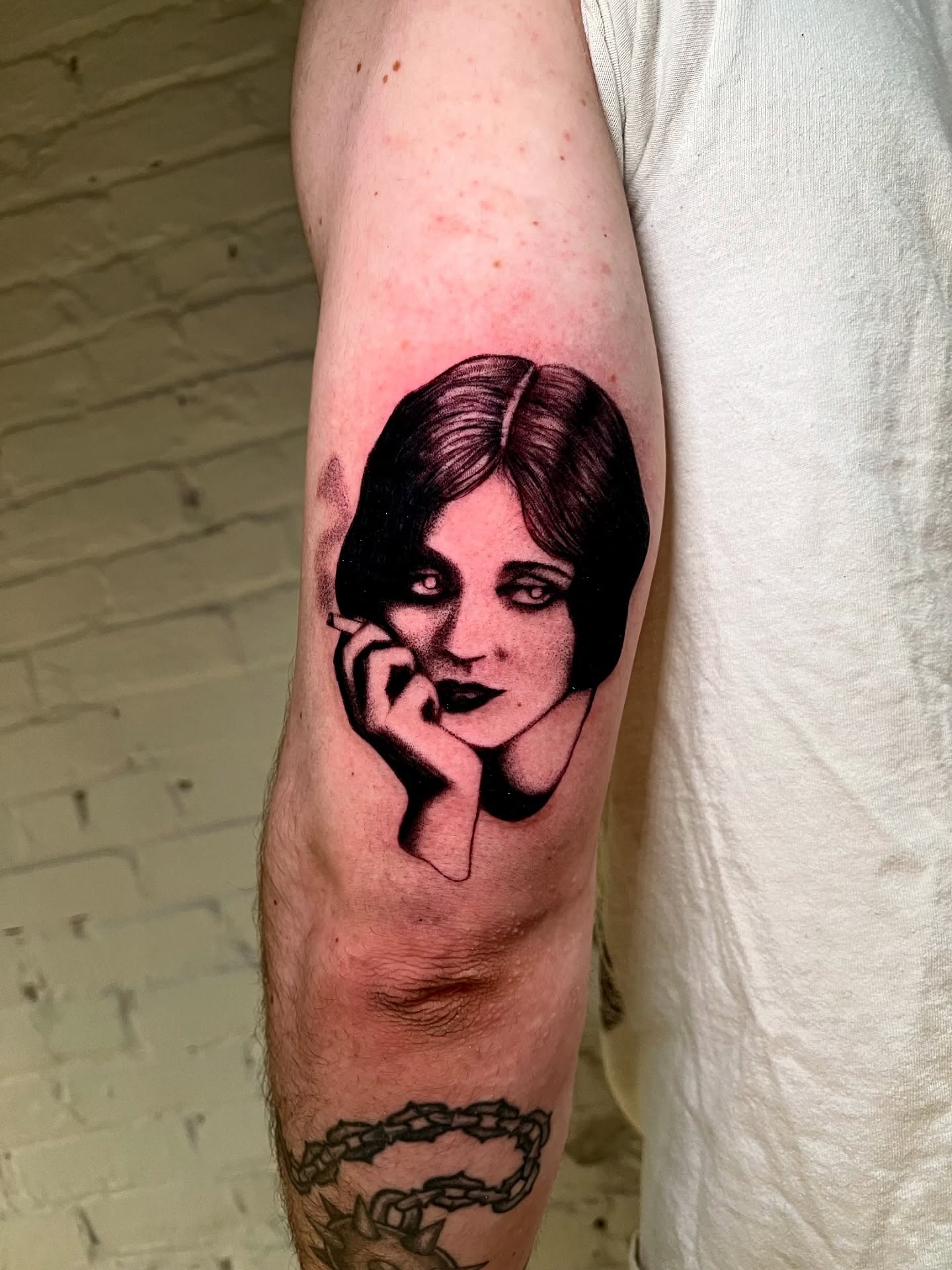 Woman black and grey tattoo on the forearm by Maddy Paige