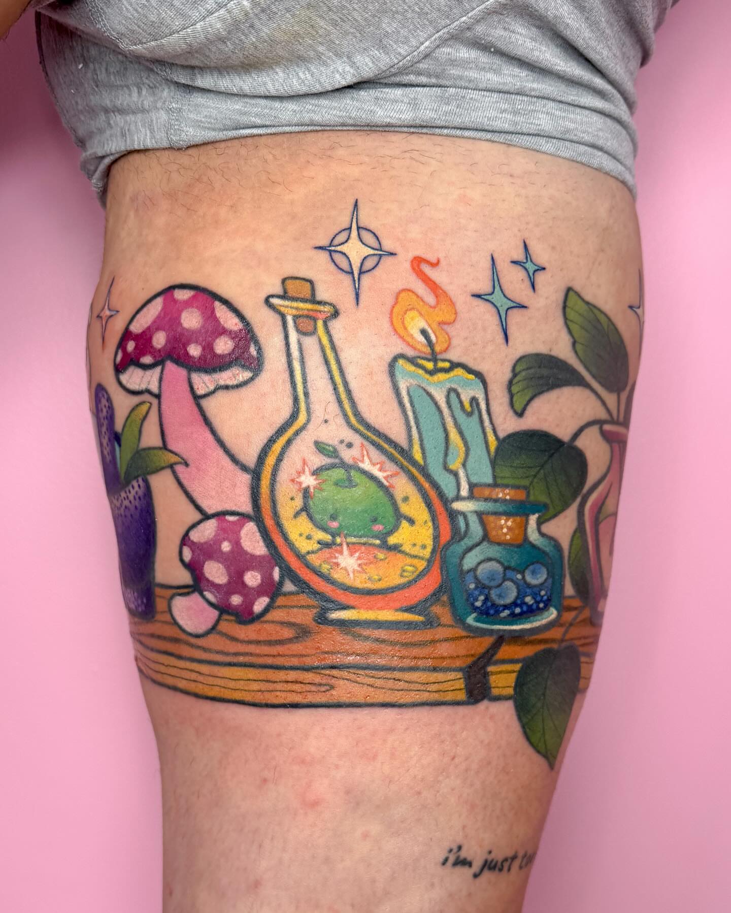 Enchanted shelf illustrative tattoo on the thigh by Janine Ramos