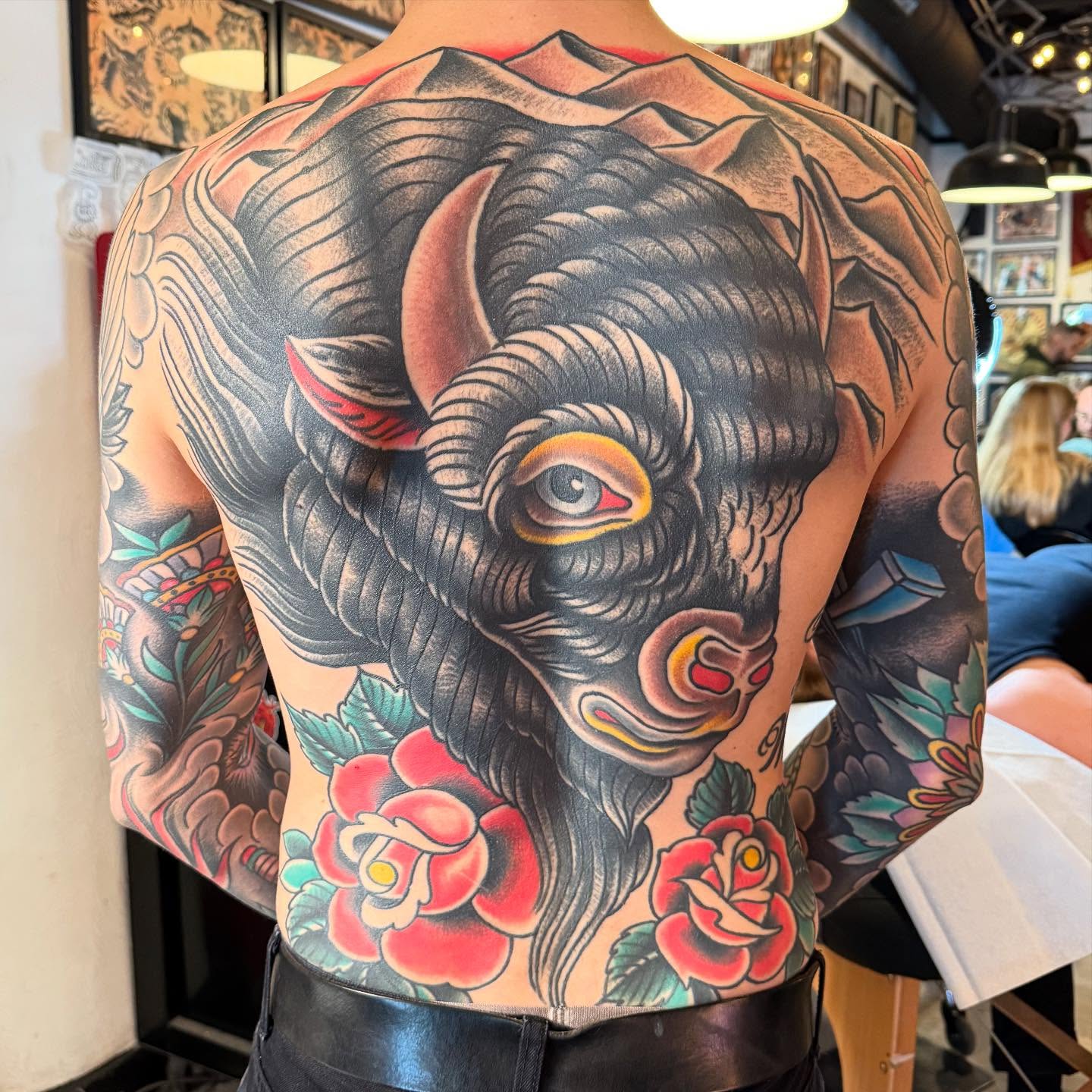 Bull and roses American traditional tattoo on the back by Zach Roman, Madison, Wisconsin