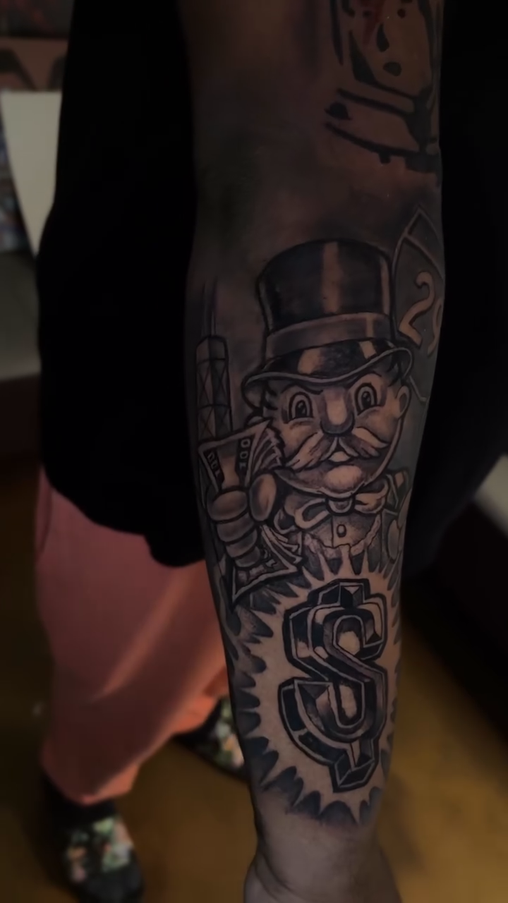 Monopoly man with dollar sign realism tattoo by Tattoo Artist👨🏼‍🎨