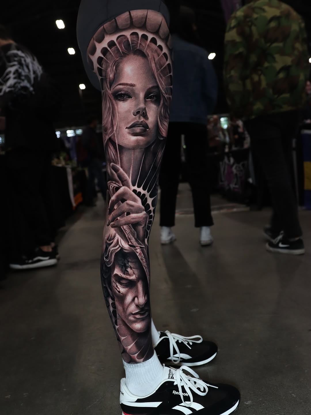 Woman and man portrait surrealism tattoo on the forearm by Naomi Burke, New Westminster, British Columbia