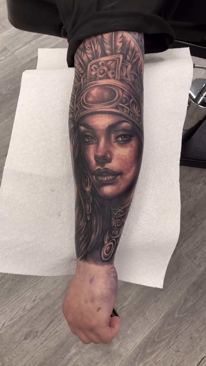 Woman with headdress realism tattoo by Danny Rodriguez