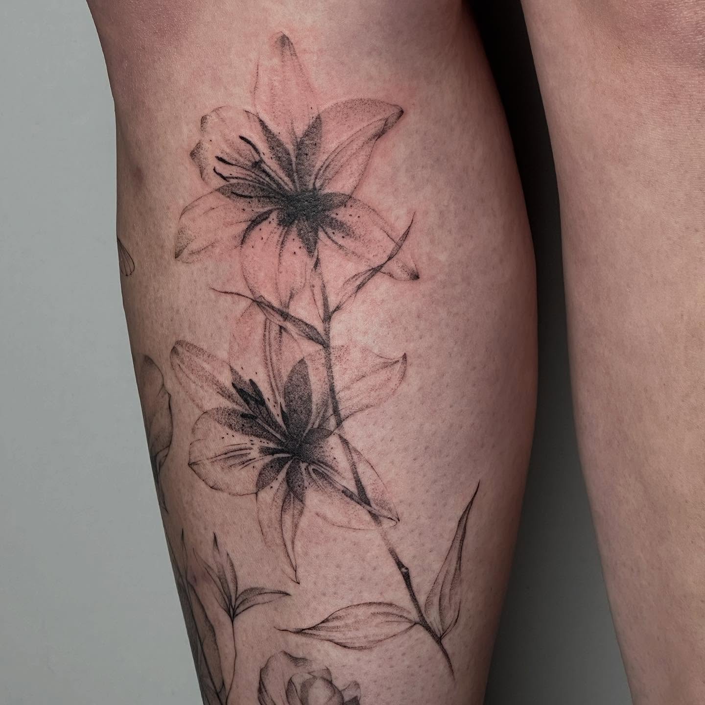 Lily flowers dotwork tattoo on the thigh by ๐๐๐๐ ๐๐๐๐