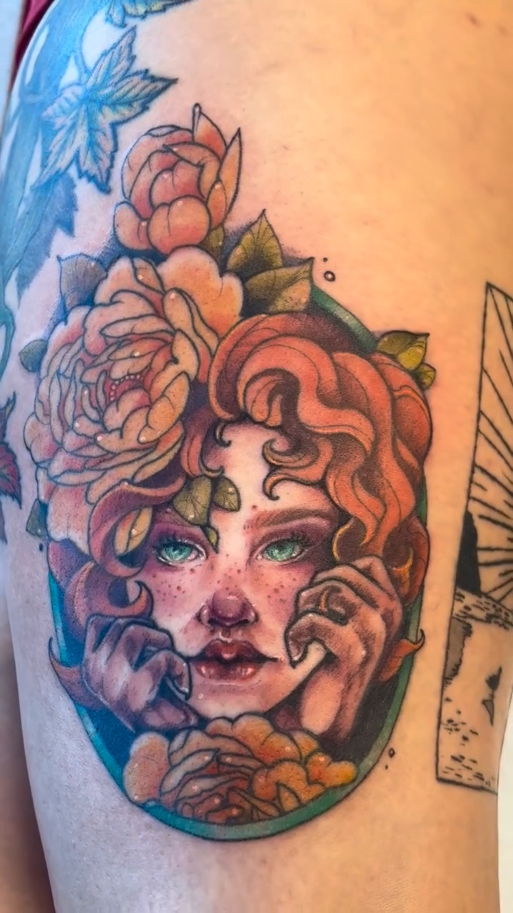 Portrait of a woman with flowers neo-traditional tattoo on the forearm by Cricket Elijah Cervidae