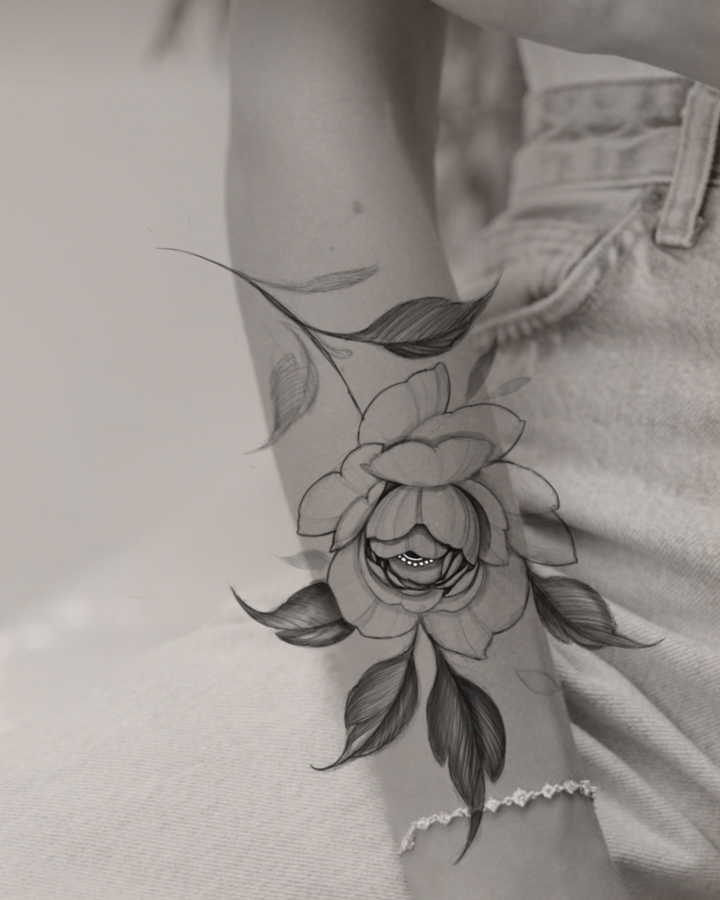 Flower black and grey tattoo on the forearm by Morrison Vo