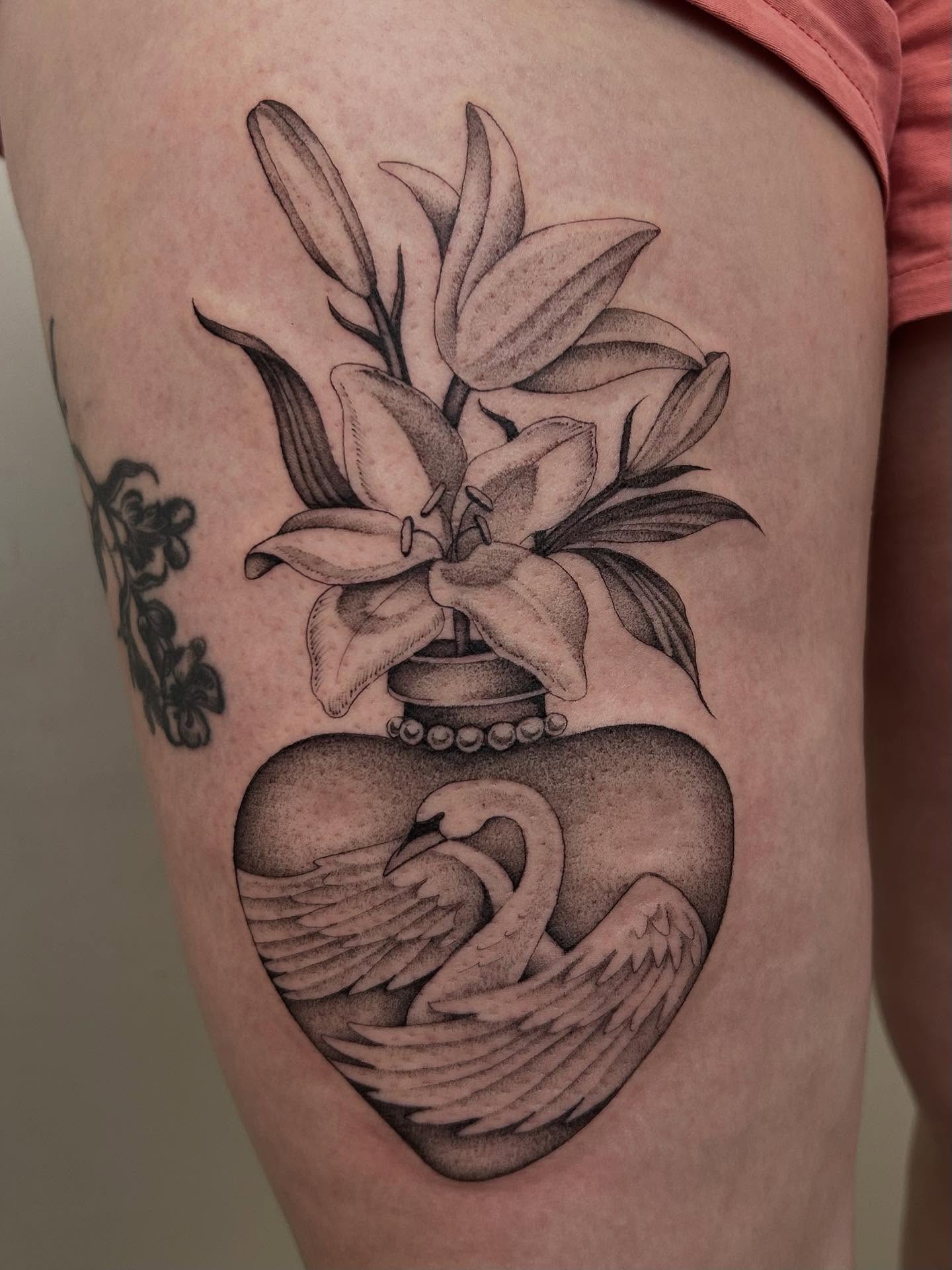 Lilies and swan dotwork tattoo on the thigh by Olivia Fox