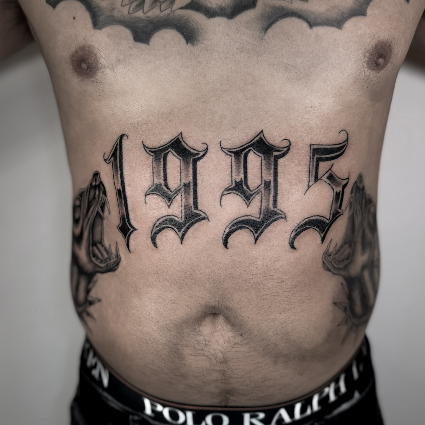 1995 black and grey tattoo on the torso by @sadfoo_tattoo, Austin, Texas