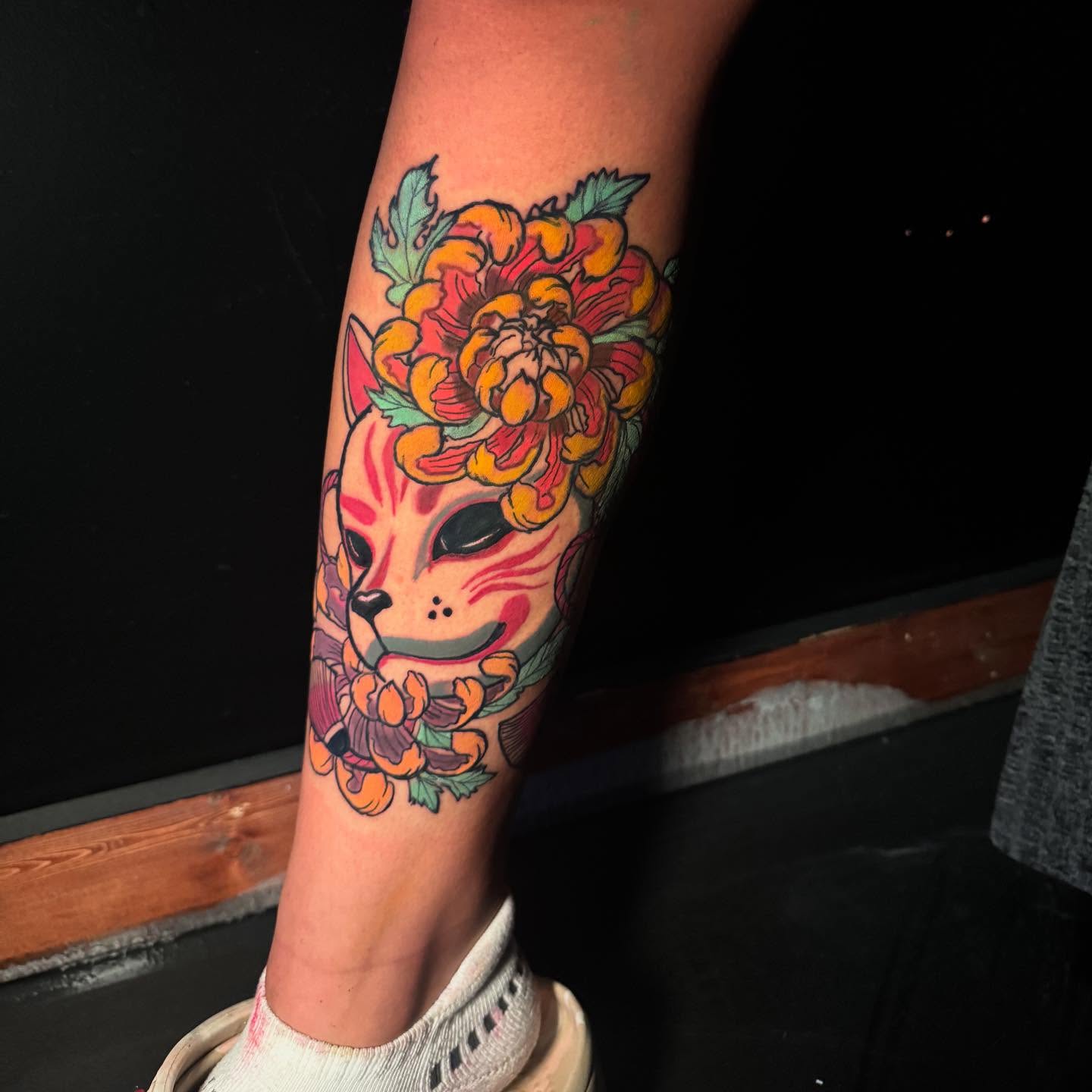 Cat skull with flowers new school tattoo on the forearm by Anthony Washington, Atlanta, Georgia