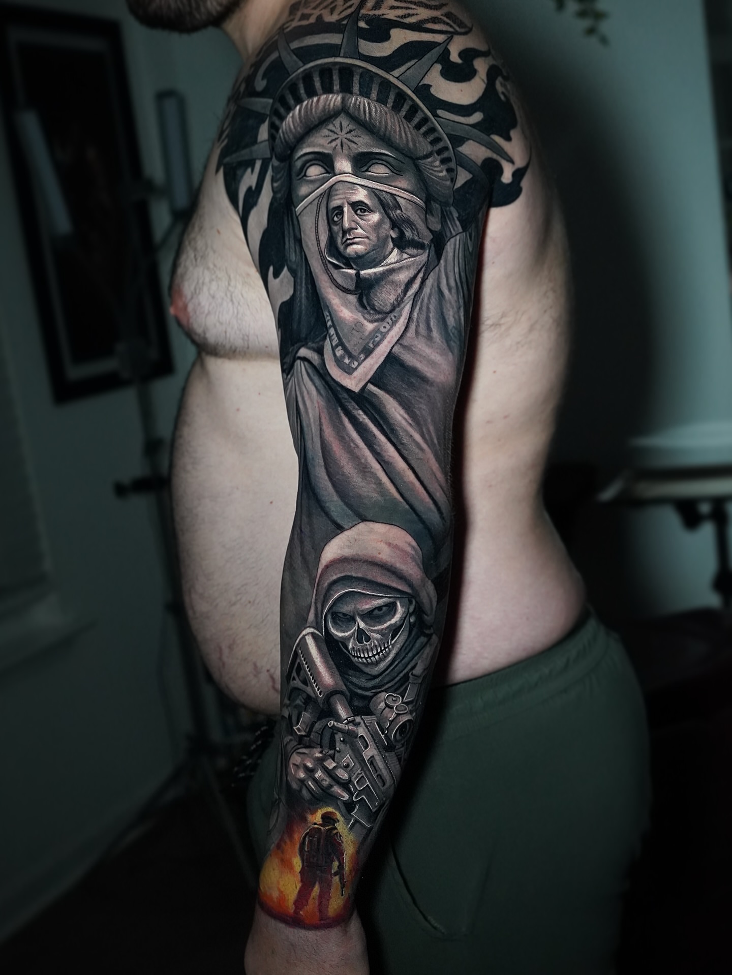 Statue of liberty with grim reaper realism tattoo on the forearm by Luis Gil
