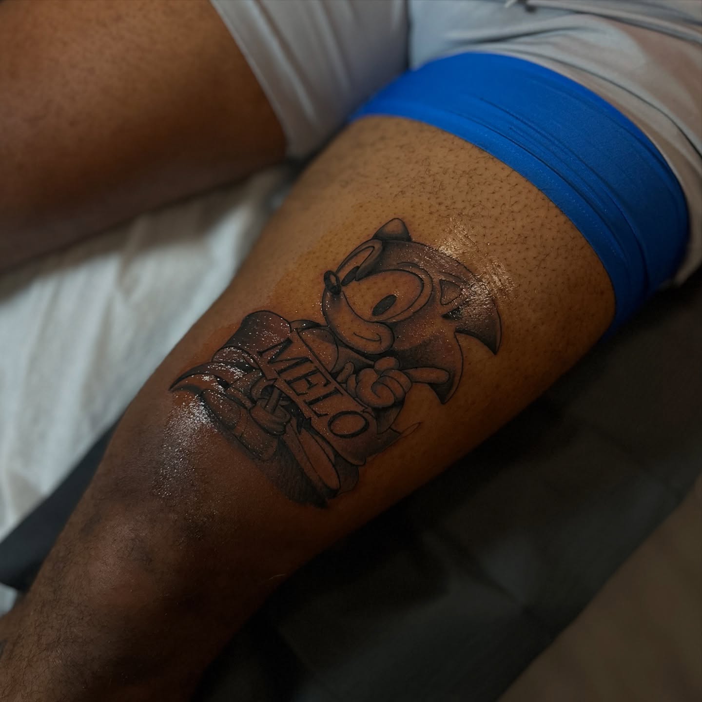 Sonic the Hedgehog black and grey tattoo on the forearm by mssinderella