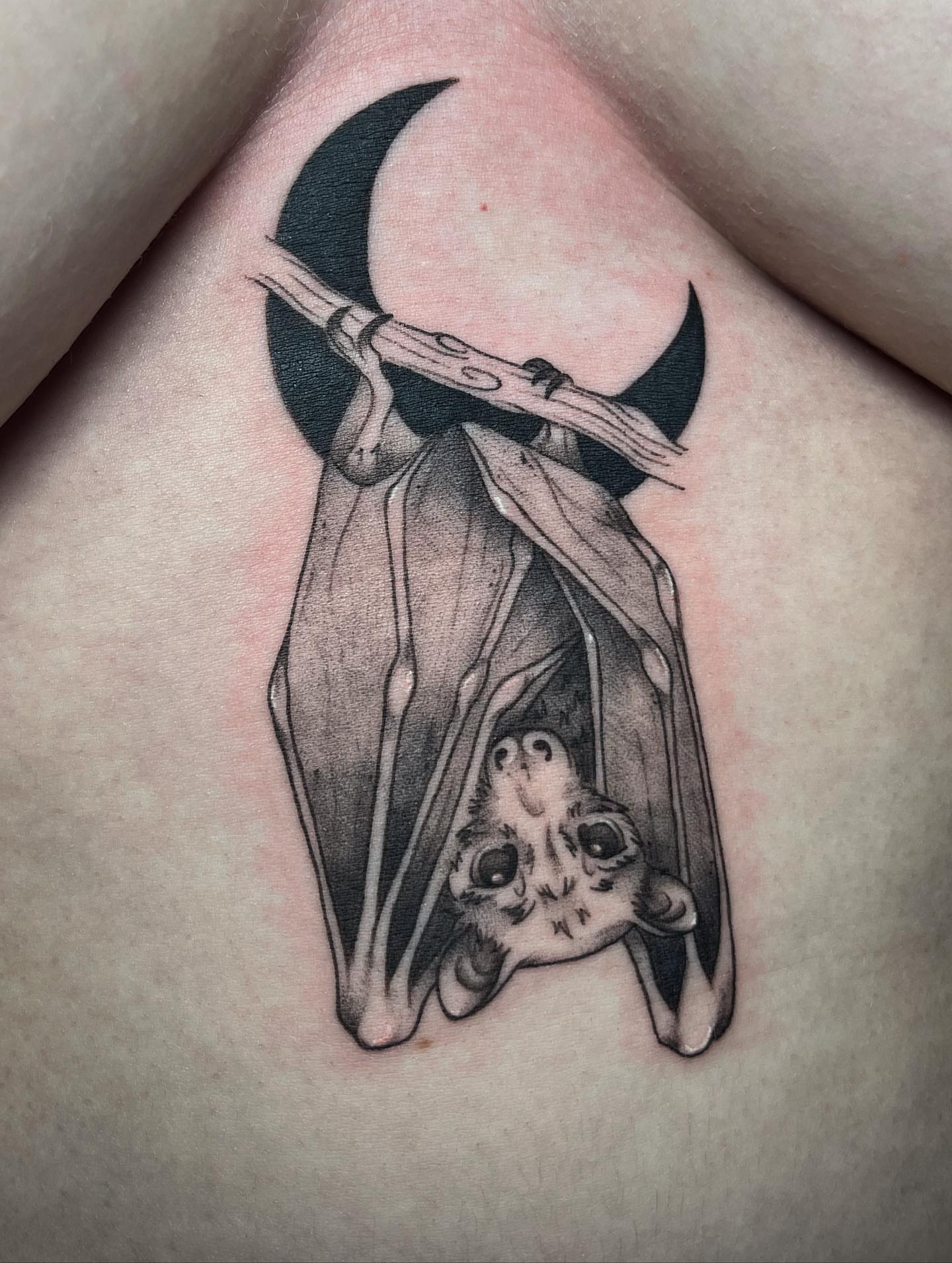 Bat black and grey tattoo on the chest by Ty’s Tattoos