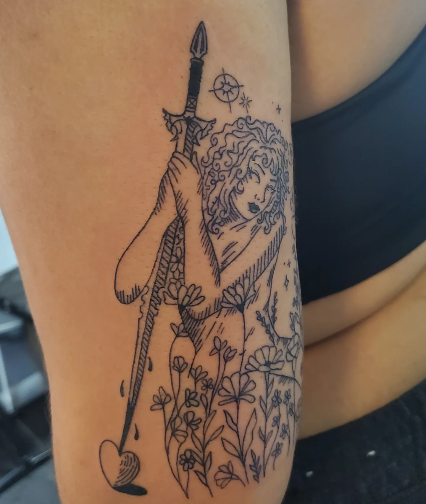 Woman with sword illustrative tattoo on the thigh by Shailey Pasquale