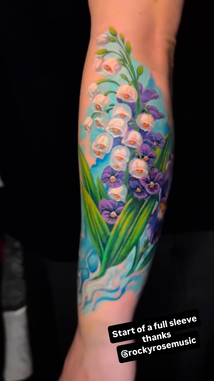 Lily of the valley and iris realism tattoo by Jamie Lee Parker