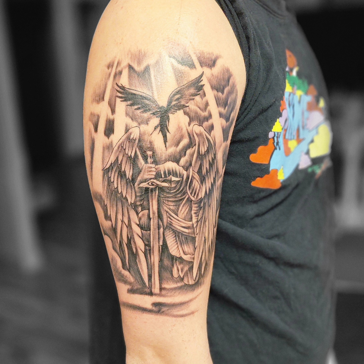 Angelic guardian realism tattoo on the forearm by Dennis Foust