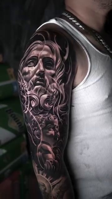 Greek god sculpture realism tattoo by Tattoos By Chino