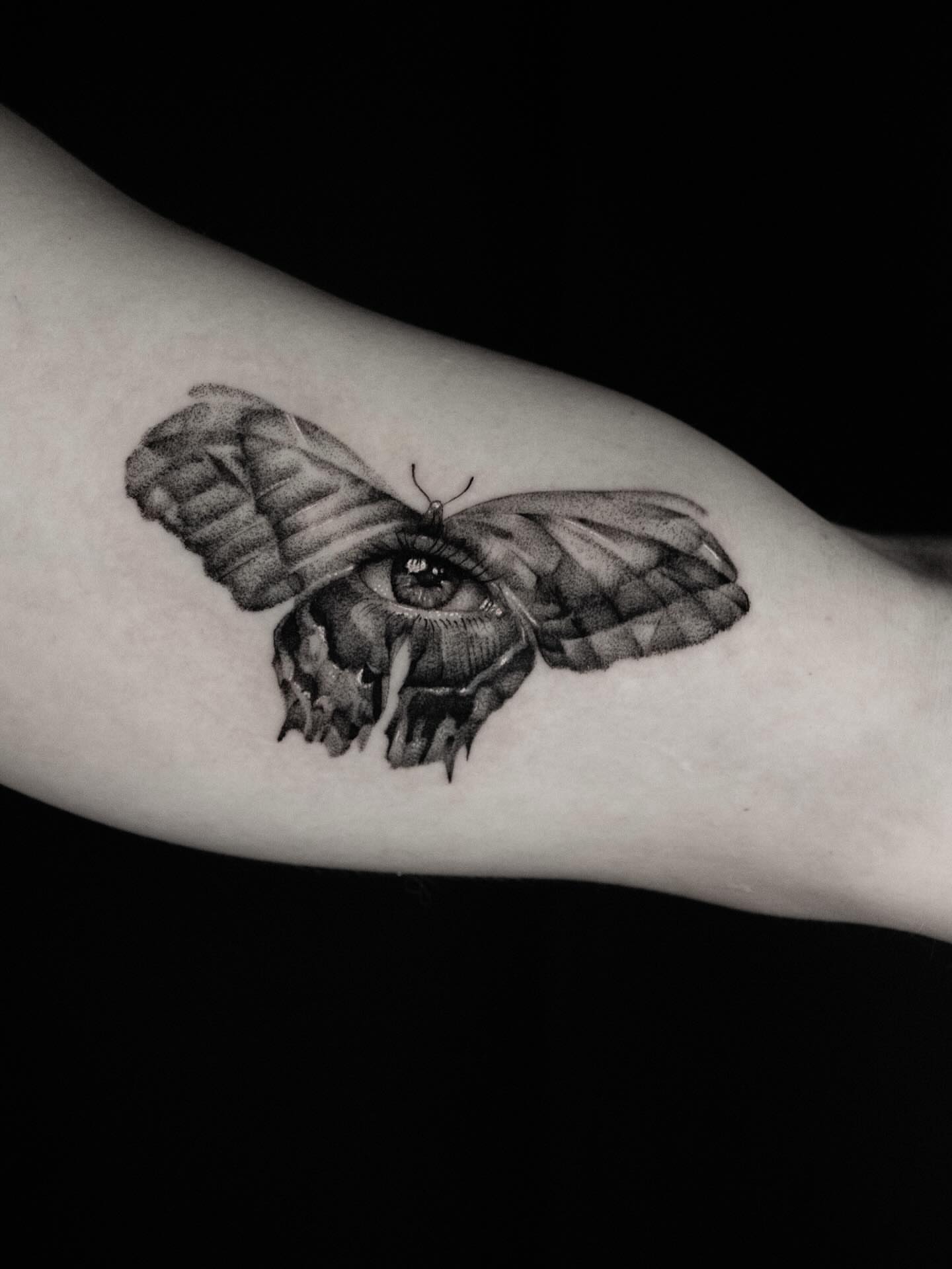 Eye moth realism tattoo on the forearm by Alex Suarez