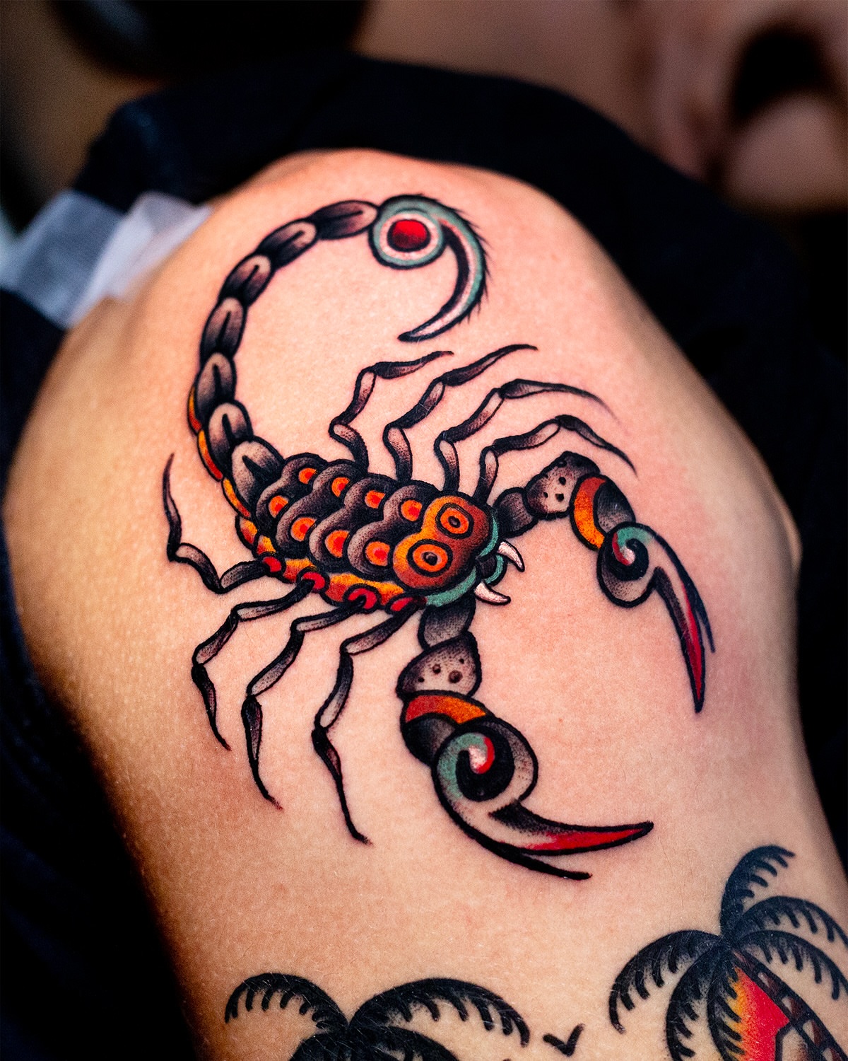 Scorpion American traditional tattoo on the shoulder by Miguel Comin