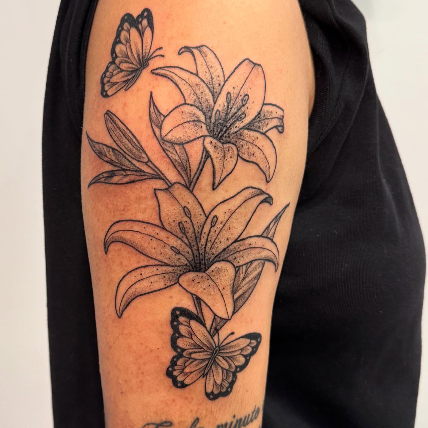 Lilies and butterflies dotwork tattoo on the forearm by Ashley Rose - Minnesota Tattoo Artist