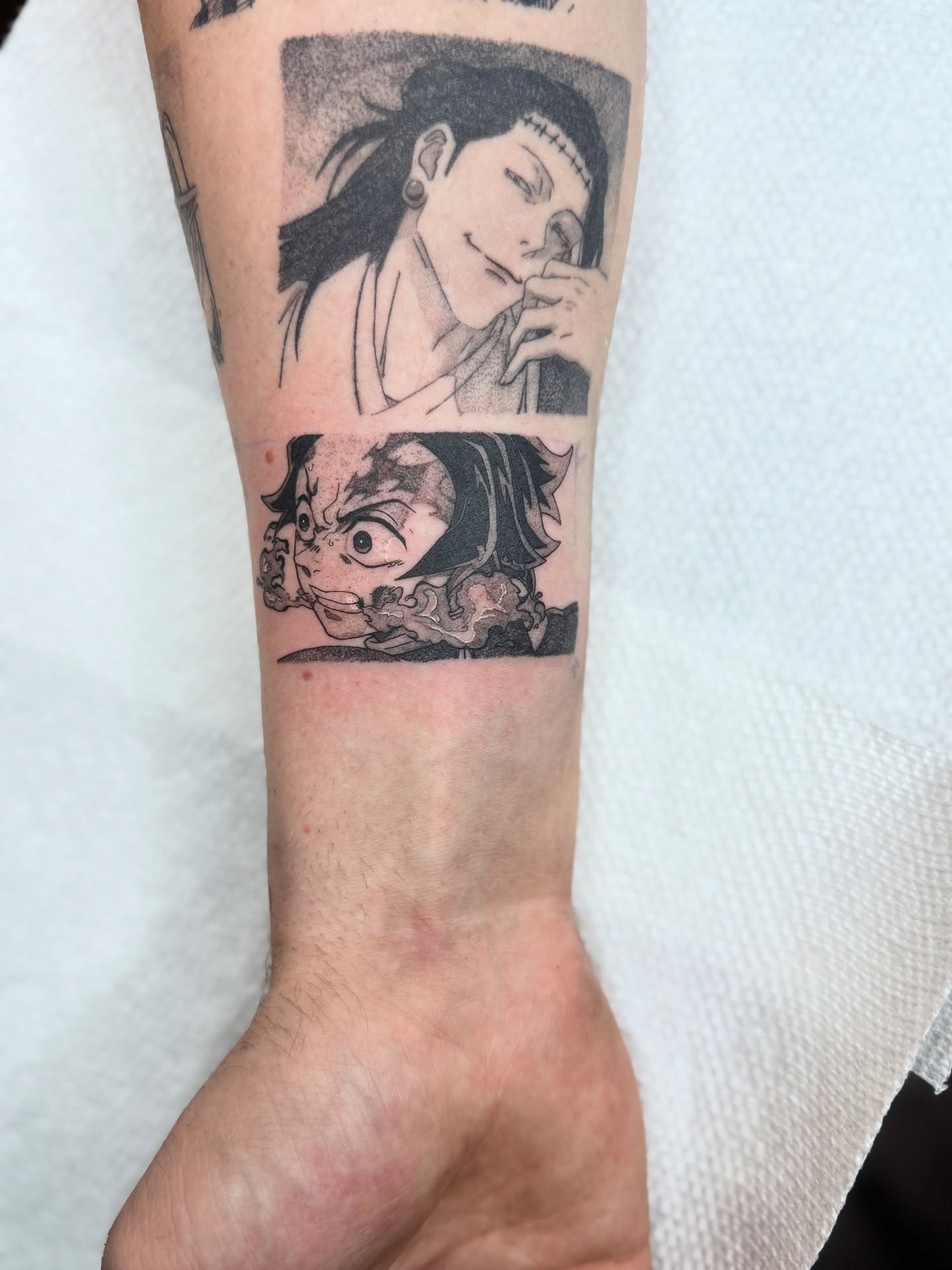 Anime characters anime tattoo on the forearm by D