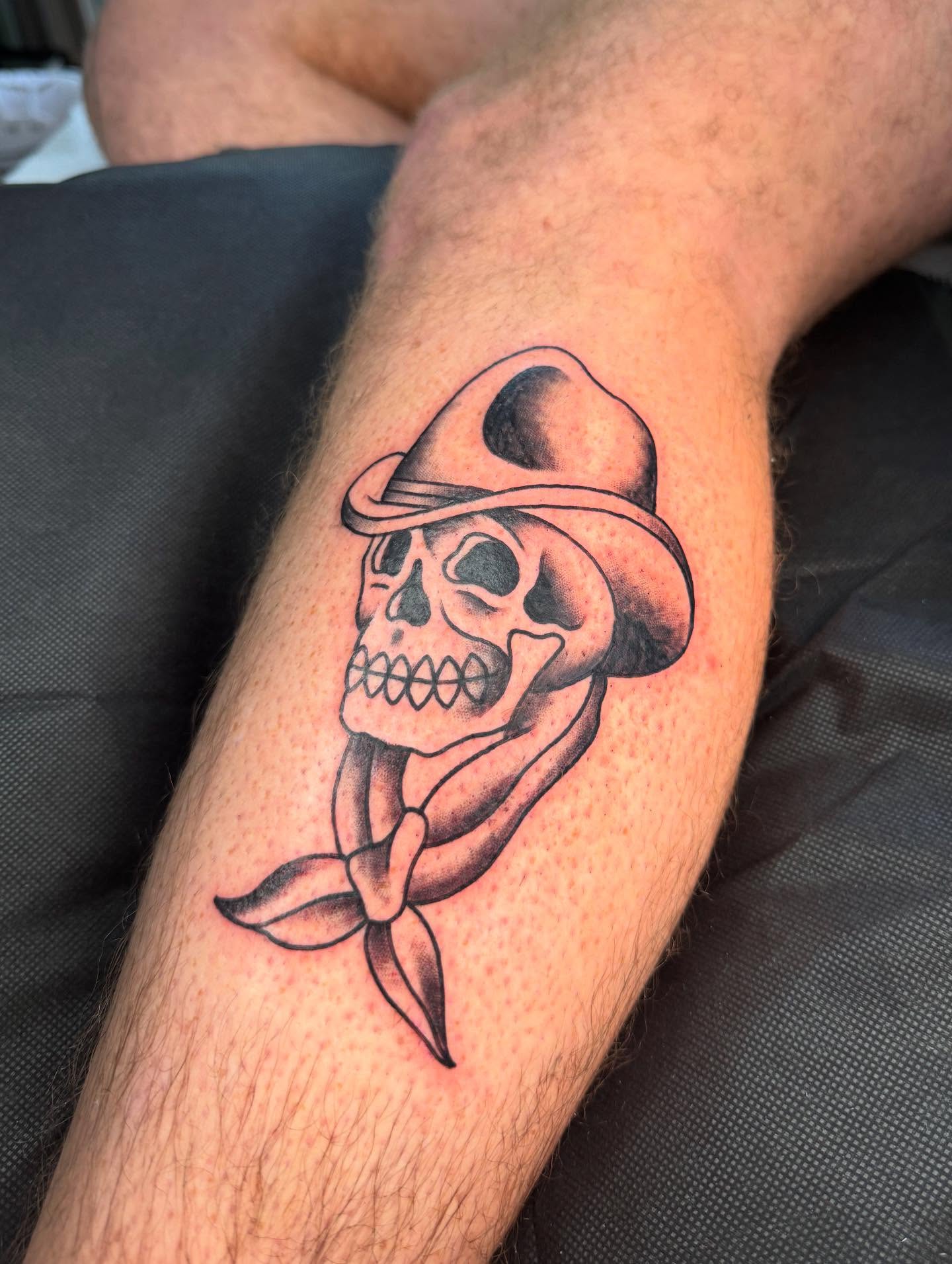 Cowboy skull black and grey tattoo on the forearm by Truett Payton