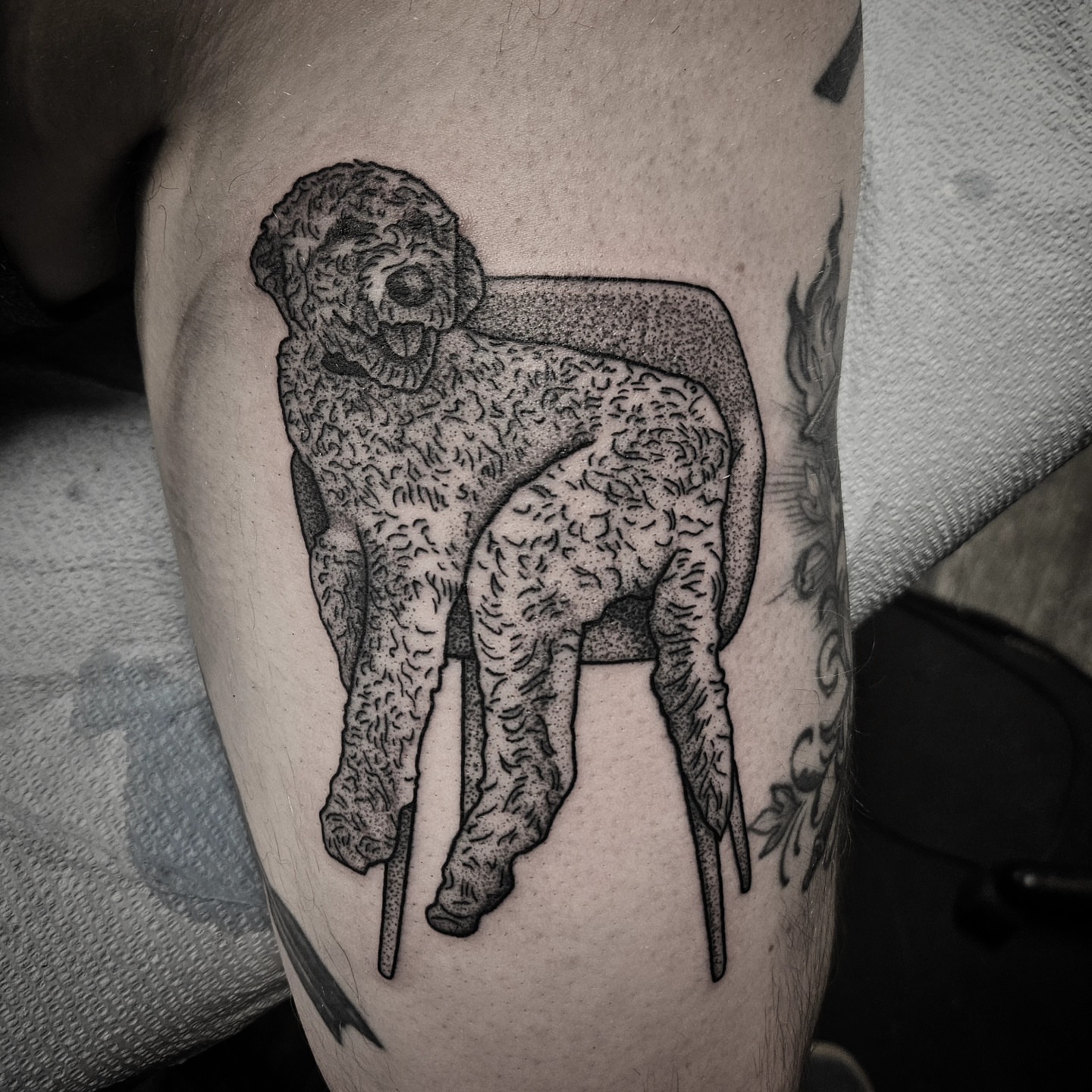 Dog on crutches dotwork tattoo on the thigh by Kirk George
