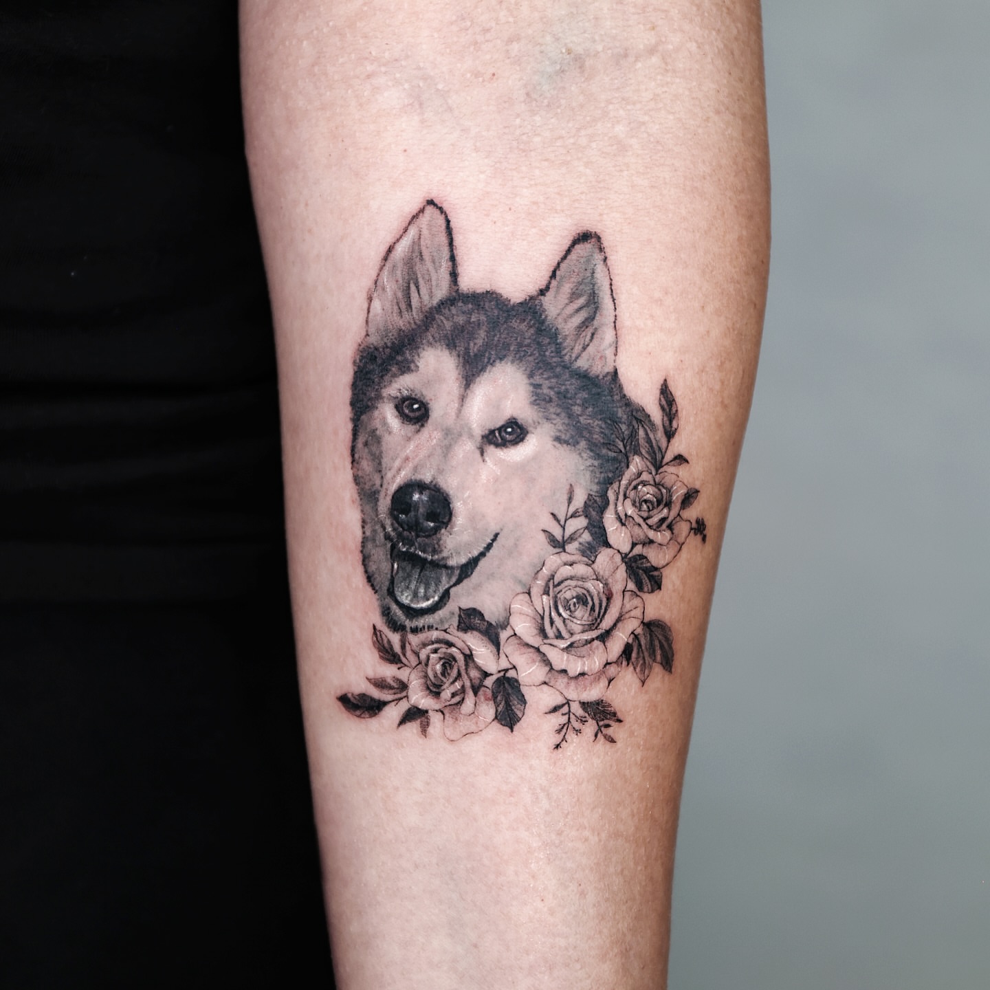Wolf with roses realism tattoo on the forearm by Adam_Zhiwei Xu(Tattooist)