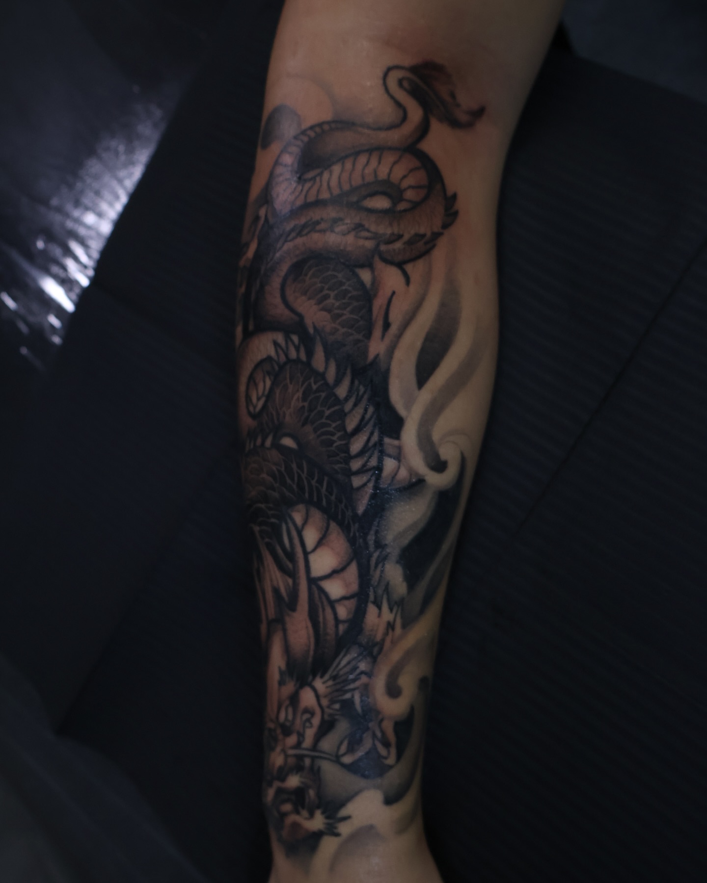 Dragon black and grey tattoo on the forearm by mssinderella