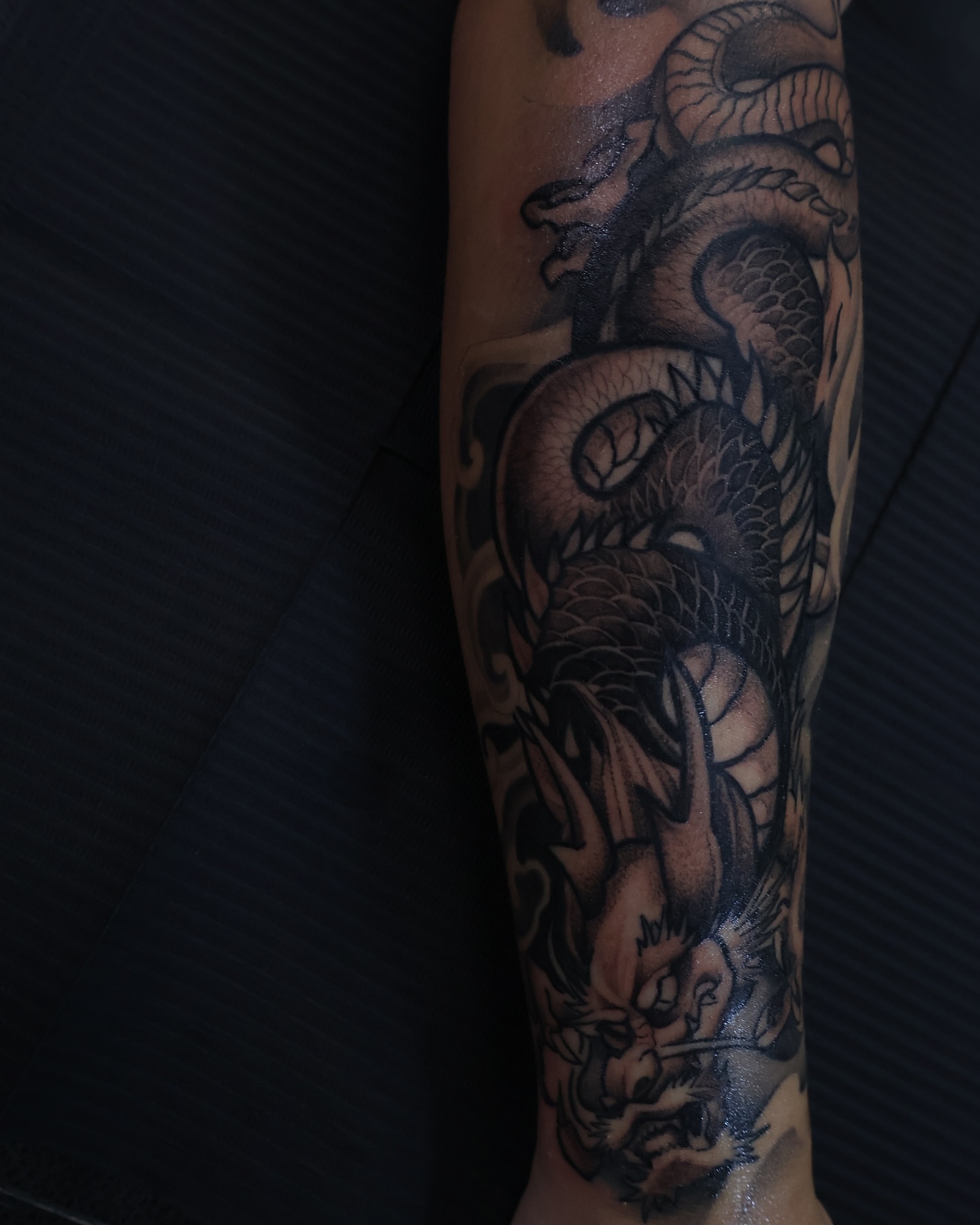 Dragon black and grey tattoo on the forearm by mssinderella