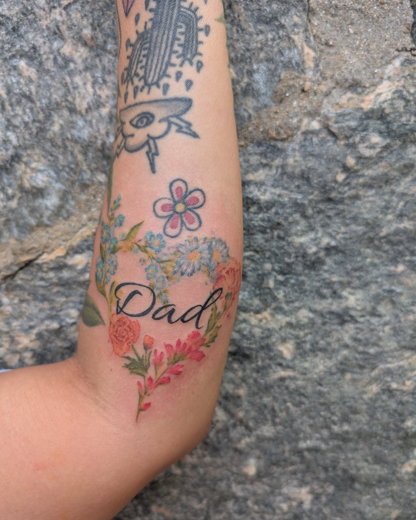 Flowers and cactus new school tattoo on the forearm by Cat